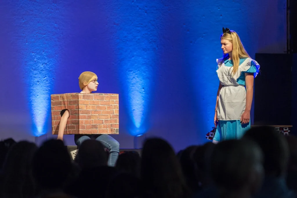 Theatre production with stage lighting and technical equipment